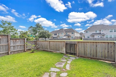 This photo showcases a quaint backyard with a wood