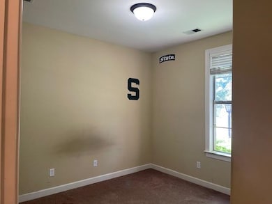 Carpeted empty room with plenty of natural light