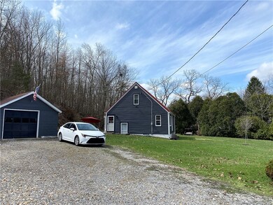 Detached garage leads into side door to kitchen.