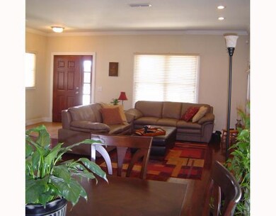 Living Room. A view from the dining room looking at front door