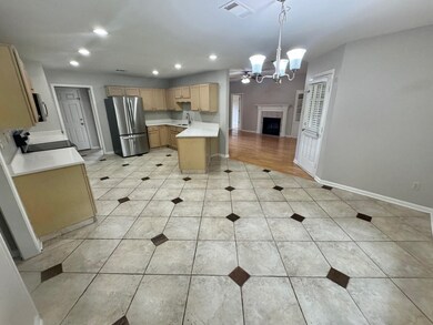 Kitchen with range, light hardwood / wood-style fl