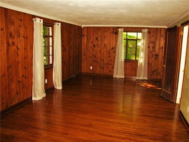 Beautiful wood surrounds the Living Room.