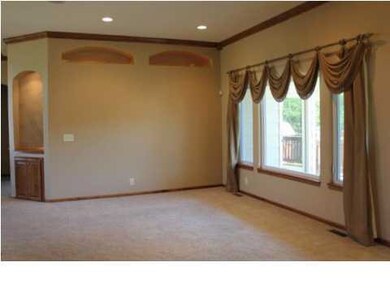 Living room has lighted accent niches