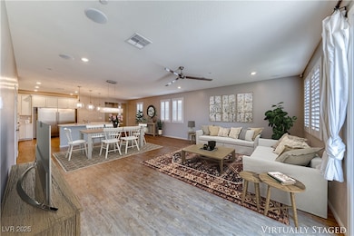 Living area with wood finished floors, baseboards,