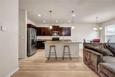 Kitchen with a breakfast bar, light wood finished 