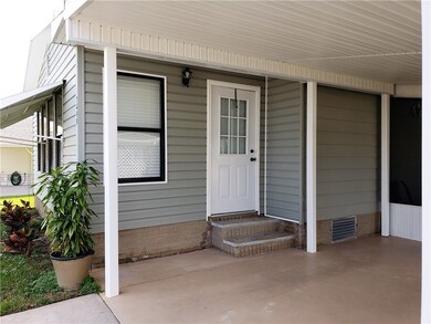 Entry to Florida room screened porch to right