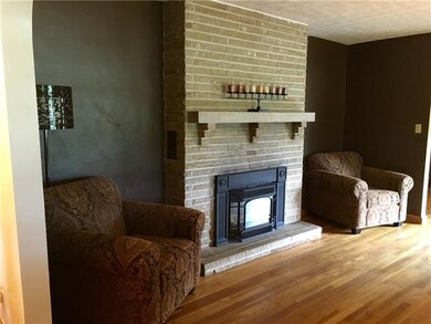 BEFORE: Gas fireplace in living room