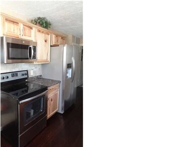Kitchen with new stainless steel oven, built-in mi