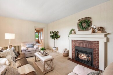 Brick fireplace is the centerpiece of the living room