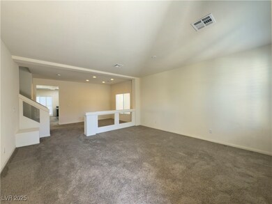Spare room with visible vents and dark carpet