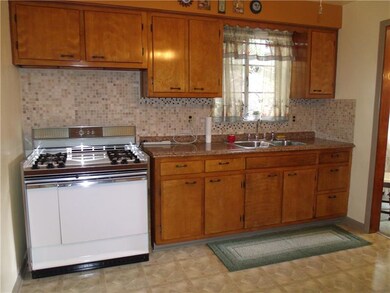 EAT IN KITCHEN WITH NEWER COUNTER TOP AND FLOORING