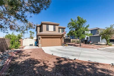View of front of property with a garage, stucco si
