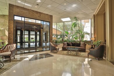 The building's entryway exudes modern elegance, cr