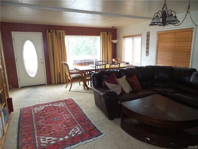 Cozy Leather Sofa in front of second fireplace.