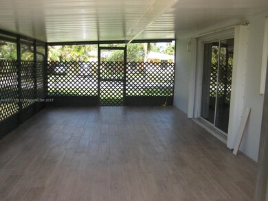 Covered patio with same rectified tile from the interior allows you to bring outside living inside and out.