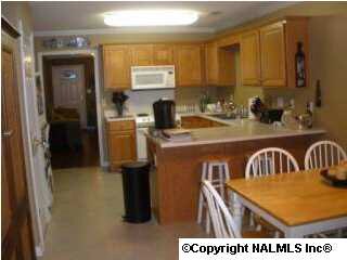 OPPOSITE VIEW OF KITCHEN/DINING ROOM.