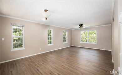 Spare room featuring ornamental molding, wood finished floors, and ceiling fan
