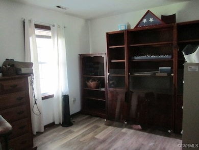 Bedroom with light wood-style floors