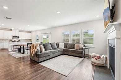 Living room with recessed lighting, wood finished 