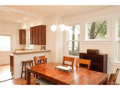 The Kitchen & Dining Room have a modern and open flow while historical details have been preserved with the original Fireplace mantle and hardwood floors.