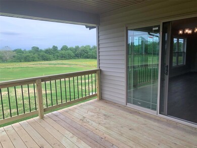 covered deck off dining area overlooks the back po
