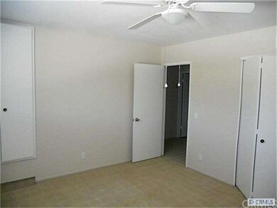 Master bedroom with two closets and new ceiling fa