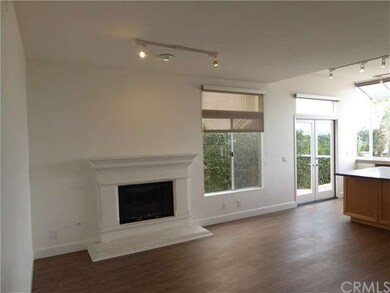 Fireplaced family room open to kitchen for enterta