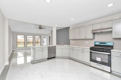 Kitchen with quartz countertops and new appliances