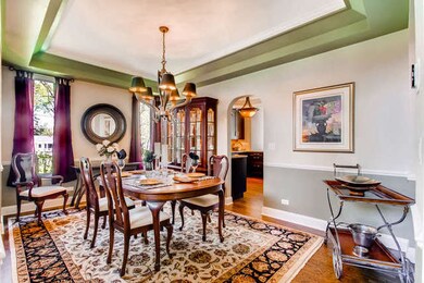 Features tray ceiling and hardwood floor
