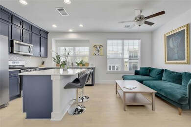 Kitchen with stainless steel appliances, a breakf