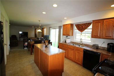 Recessed lighting highlights the kitchen.  It incl