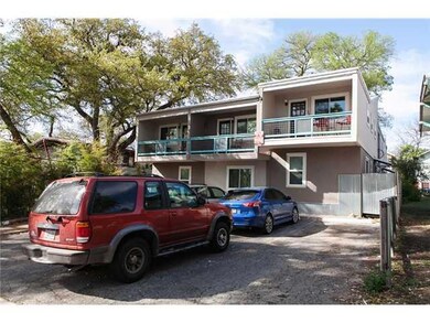 View of front of property with a balcony and stucco siding