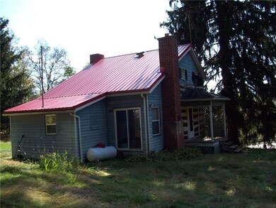 REAR/SIDE VIEW OF HOUSE