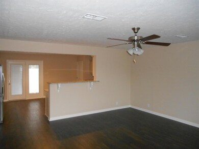 great room/kitchen/dining room/powder room w/ laminate flooring