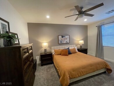 Carpeted bedroom with recessed lighting, baseboard