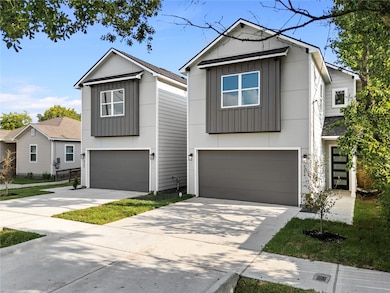 Modern curb appeal with a fresh, clean façade and welcoming entry that sets the tone for this newly built home.