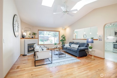 Skylights, vaulted ceilings & hardwood floors.