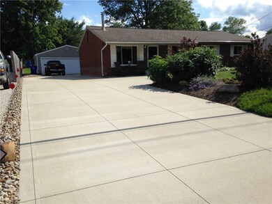 The double wide concrete drive is like new!
