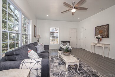 Hardwood floored living room with a wealth of natu