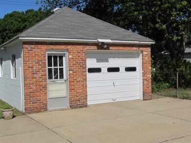 Single Garage with Shop area in rear of property.