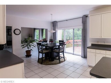 Spacious Eat-in Kitchen with White Cabinets, Cente