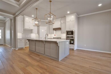 Kitchen with white cabinets, light wood-type floor