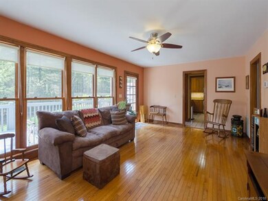 Bright family room with floor to ceiling windows