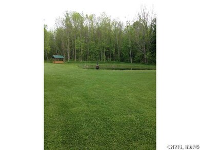 Backyard. Pond just waiting for summer fun!