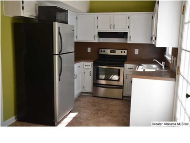 This CUTE kitchen has all the conveniences that yo
