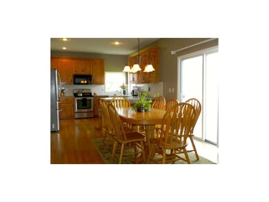 Large eat-in kitchen with sliding glass door out t