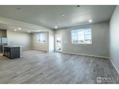 EXAMPLE PHOTO: GREAT ROOM, DINING ROOM AND KITCHEN