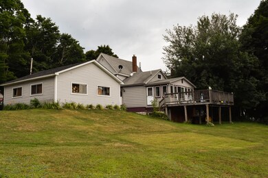 4. Back of home with large deck and yard