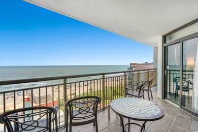 Balcony featuring a water view and a view of the b