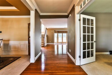 Entry foyer view- office to your right and formal dining room to your left.